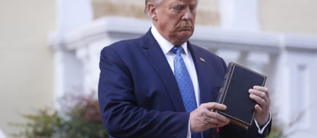 Trump Holds A Bible